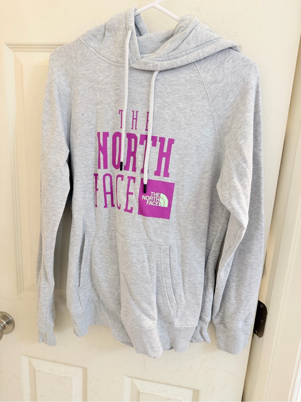 The North Face Women’s Light Gray Hoodie with Purple Logo